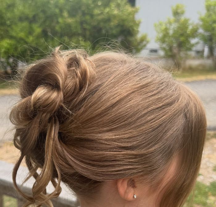 Curly textured updo hairstyle by Yiqara Hair Co.
