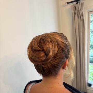 Sleek low bun updo, Yiqara Hair Co. Instagram